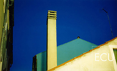 Color photograph of the colors and geometric shapes of Burano taken at dusk in winter in Venice, Italy