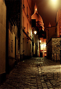 Color photograph at night of the landmark church Sacr&eacute; Coeur in Montmartre section in the 18th arrondisement in Paris