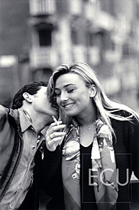 Black and white photos of Vanessa and Mauro on the vaporetto stop of San Toma on the Grand Canal in Venice, Italy